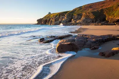 a beach with some rocks and the ocean at 1 Bed in Rinsey oc-1chapl in Praa Sands