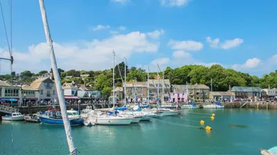 a bunch of boats are docked in a harbor at 3 Bed in Padstow oc-p00281 in St Merryn
