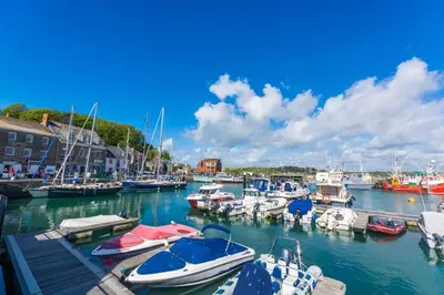 a bunch of boats docked in a marina at 2 Bed in Padstow oc-p00282 in St Merryn