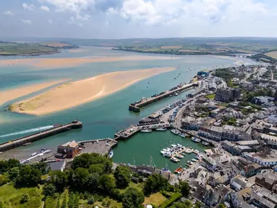 an aerial view of a harbor next to a beach at 1 Bed in Padstow oc-p00685 in Padstow