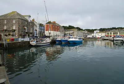 a group of boats are docked in a harbor at Nimbus Cottage in St Merryn