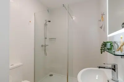 a white bathroom with a shower and a sink at 2 Bed in St. Ives oc-1seab in St Ives