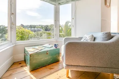 a living room with a couch and a large window at 2 Bed in St. Ives oc-6acarr in St Ives
