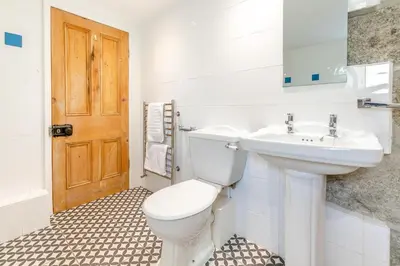 a bathroom with a toilet and a sink at 2 Bed in St. Ives oc-6carr in St Ives