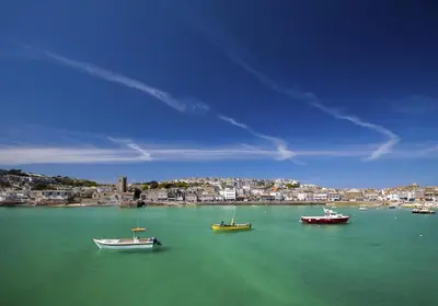 a group of boats in a large body of water at 2 Bed in St Ives oc-clv2a in St Ives