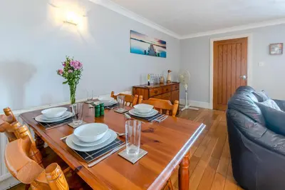a living room with a wooden table and a couch at 2 Bed in St Ives oc-lookcv in St Ives
