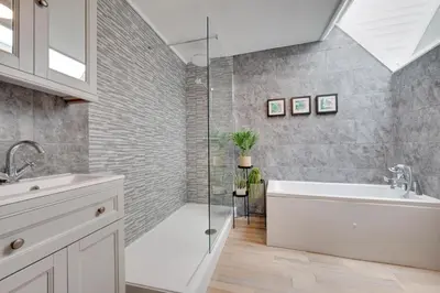 a bathroom with a shower and a tub and a sink at 2 Bed in St. Ives oc-upper4 in St Ives