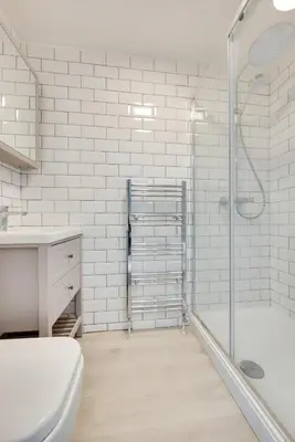 a bathroom with a shower and a toilet and a sink at 2 Bed in St. Ives oc-upper4 in St Ives