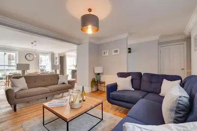 a living room with two blue couches and a table at 2 Bed in St. Ives oc-upper4 in St Ives