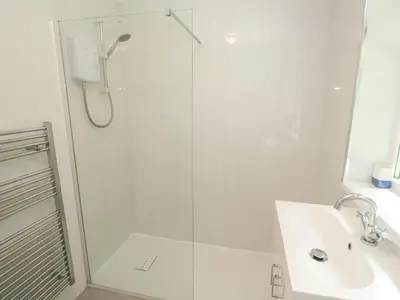 a bathroom with a shower and a sink at 11 Tremore in Liskeard