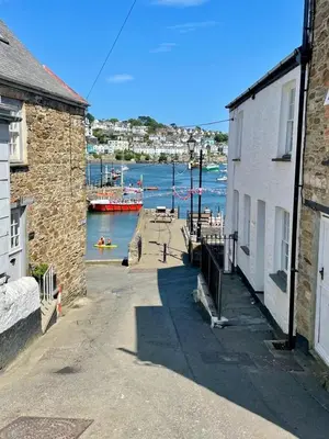 a view of a harbor with boats in the water at Enchanting Harbourside Cottage with Panoramic Views in Polruan