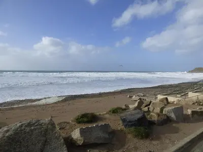 a beach with some rocks and the ocean at Shepherds Retreat in Launceston
