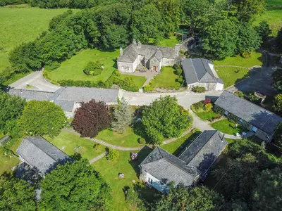an aerial view of a house with a yard at Drovers in Lanteglos