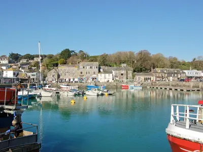 a group of boats are docked in a harbor at Bellagio in Padstow
