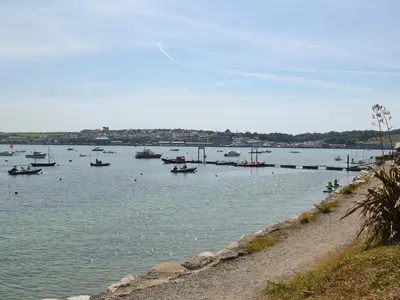 a large body of water with boats in it at Nan-Tis in St. Issey