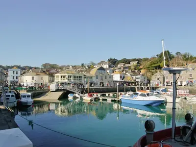 a group of boats are docked in a harbor at Spring Tides in Padstow
