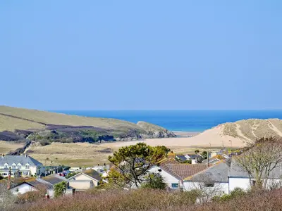 a small town with houses and the beach at Dover Row Cottage in Zelah