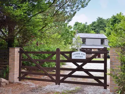 a wooden gate with a private entry sign on it at Coombe End Cottage in Carnbrea
