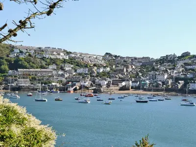 a bunch of boats sitting in a body of water at Florin Cottage in Lerryn