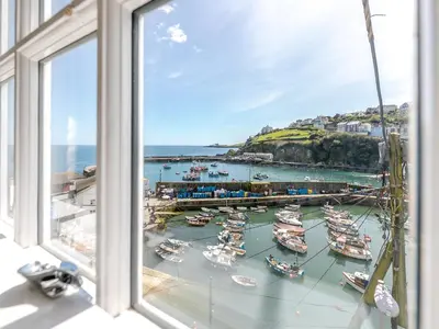 a view of a harbor with boats in the water at Memory Cottage in Mevagissey