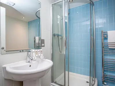a bathroom with a sink and a shower at Villa Gallery - 27074 in Perranwell