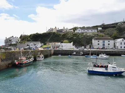 a group of boats are docked in a harbor at Wheal Metal Lodge in Carleen