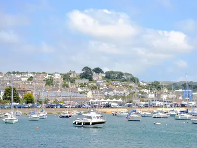 a bunch of boats docked in a harbor at Beach Comber Cottage in Marazion