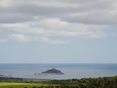 an island in the ocean in the distance at Heather Brae Lodge in Nancledra