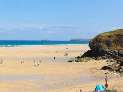 a group of people on a beach near the ocean at 1 Queensway Gardens in Hayle