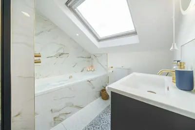 a bathroom with a sink and a shower at NEW! Stunning 2 Bed Beach Front Penthouse Apartment - Topaz, Compass Point in Carbis Bay