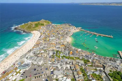 an aerial view of a beach next to the ocean at SeaBreeze 3 - seaview & Parking in St Ives