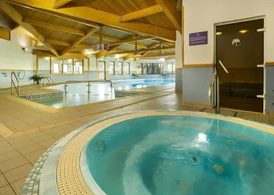 a large hot tub in the middle of a building at Pottsville Cabin Sleeps 4 with Deck in Praa Sands