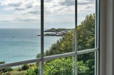 a view of the ocean from a window at Finest Retreats - Tregatreath in Coverack