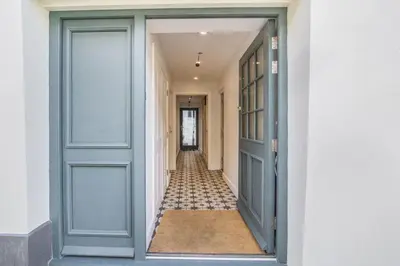 a hallway with a blue door and a hallway with a hallwayngth at Hawkers Padstow in Padstow
