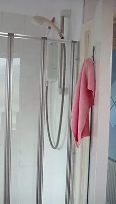 a bathroom with a shower with a pink towel at Bed & Breakfast Only - not 24 hour lodging - Truro, Cornwall - free parking in Truro