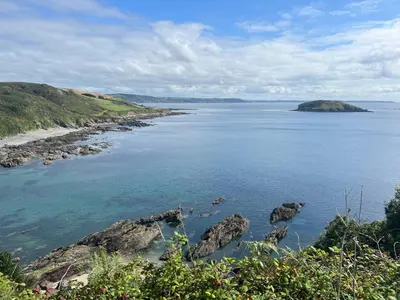 a view of a large body of water with rocks at The Captain's House in Looe