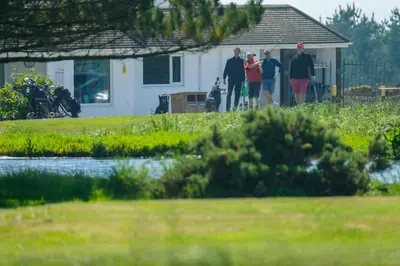a group of people standing in front of a house at Cosy room with golf & the beach on your doorstep! in Mawgan Porth