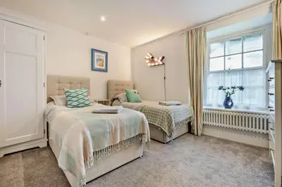 a bedroom with two beds and a window at 3 Bed in St. Breward oc-g28144 in Saint Breward