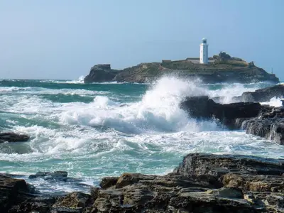 a lighthouse in the ocean with waves at 2 Bed in Redruth oc-86269 in Gwennap