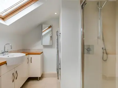 a bathroom with a shower and a sink at 4 Bed in Polruan oc-pc044 in Fowey