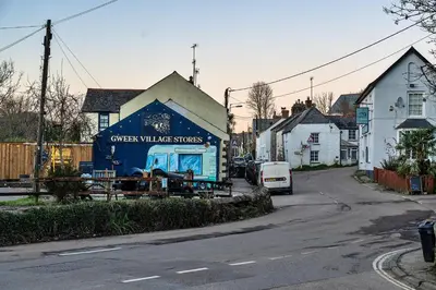 a blue truck parked in front of a house at Finest Retreats - The Old Counting House in Gweek