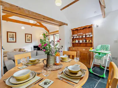 a dining room with a wooden table and chairs at 2 Bed in Launceston oc-02043 in North Petherwin