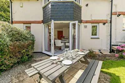 a picnic table in the backyard of a house at 2 Bed in St. Ives oc-92928 in Carbis Bay