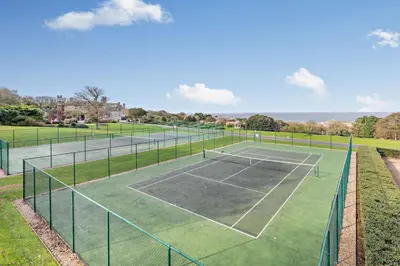 a tennis court with two tennis courts at 2 Bed in St. Ives oc-92928 in Carbis Bay