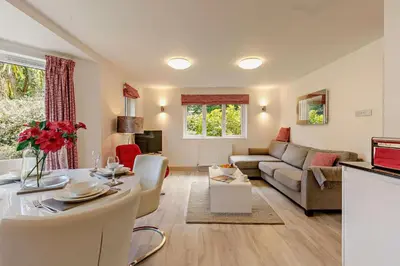a living room with a couch and a table at 2 Bed in St. Ives oc-92928 in Carbis Bay