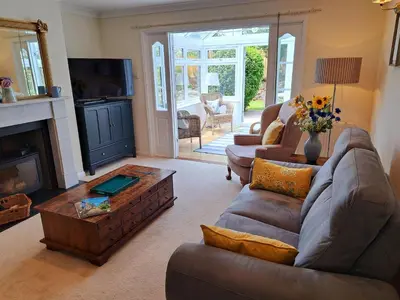 a living room with a couch and a coffee table at Trevallion in Saint Endellion