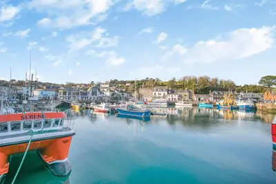 a group of boats are docked in a harbor at 2 Bed in Little Petherick oc-w28425 in Little Petherick