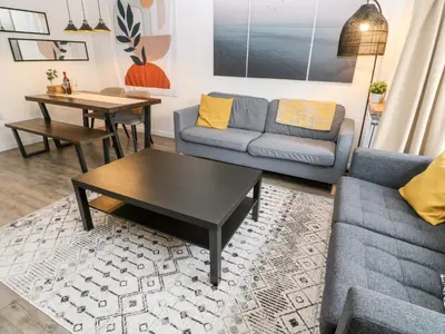 a living room with a couch and a coffee table at 20 Bishops Way in Falmouth