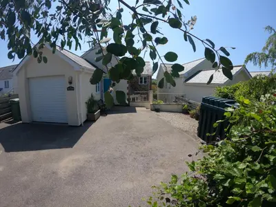 a driveway leading to a house with a garage at Number Six in St. Agnes