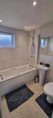 a bathroom with a tub and a toilet and a sink at Two Bedroom Lodge In The Country - Restaurant Bar Onsite in Liskeard